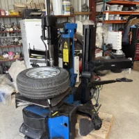 Used Hofmann Megaplan tyre changer for sale with assist arms
